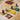 Blue Orange Moon River family game with colorful river-themed game pieces and cards on a wooden table.