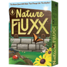 Family game scene featuring Nature Fluxx card game by Looney Labs, with colorful cards and playful setup.