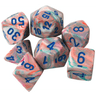 Chessex 7-piece polyhedral dice set in festive pop-art colors, featuring vibrant, colorful dice for tabletop gaming.