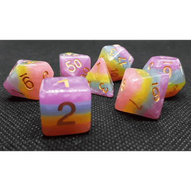 Cream-colored rainbow-themed dice set from Dice 4 Friends, featuring vibrant, multi-colored dice for tabletop gaming.