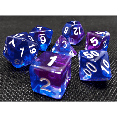 Transparent dice set with indigo sea marbling from Dice 4 Friends, featuring clear and blue-toned polyhedral RPG dice.