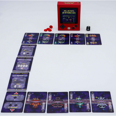 Family game "Aliens Attack!" by Matagot featuring colorful alien-themed artwork and game components on a table.