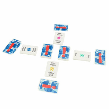 Anomia party game by Coiled Spring Games, showing colorful game cards and tokens on a table.