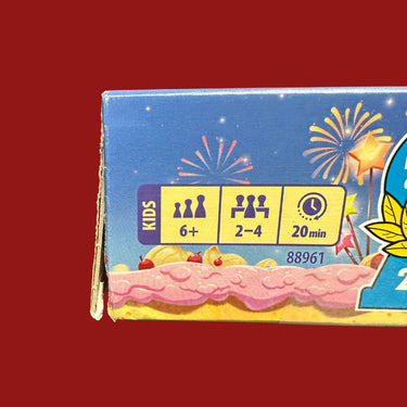 Cherry on the Cake (DAMAGED) - a tear down the front-left edge of the box, exposing the cardboard beneath