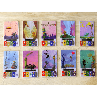 Family game canvas by Road to Infamy Games featuring colorful illustrations and game instructions on a flat surface.