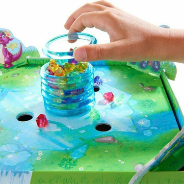 Children's game Dragon's Breath by HABA showing colorful game pieces and dragon-themed game box for kids' fun activity.