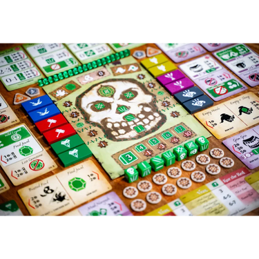 Emerald Skulls strategy game by Thunderworks Games featuring colorful skull tokens and game components on a game board.