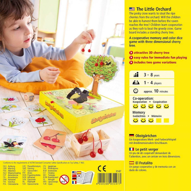 HABA Little Orchard children's game with colorful fruit pieces and game board, designed for young kids.
