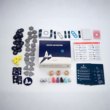 Oink Games Moon Adventure strategy game box with colorful artwork and game components on a wooden surface.