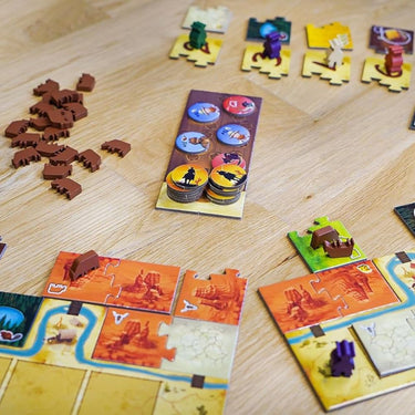 Blue Orange Moon River family game with colorful river tiles and game pieces on a wooden surface.