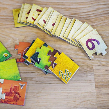 Blue Orange Moon River family game featuring colorful river and boat pieces on a game board with family-friendly design.