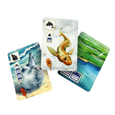 Rebel Studio Meadow: Downstream family game box with colorful artwork and game pieces on a table.