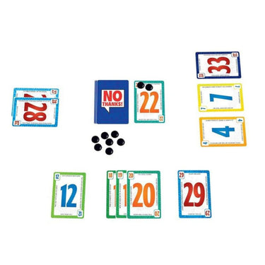 Family card game "No Thanks!" by Amigo featuring colorful playing cards and game pieces on a wooden table.