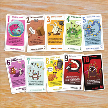 Power Hungry Pets family game by Exploding Kittens featuring colorful cartoon animals and playful game components on a table.