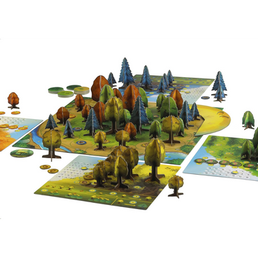 Abstract game Photosynthesis by Blue Orange featuring colorful tree pieces and a lush green game board.