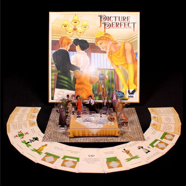 Family game box for Picture Perfect by Arcane Wonders featuring colorful artwork and game components on a table.