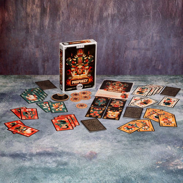 Family game Prophecy by IELLO featuring colorful fantasy-themed cards and game components on a table.