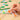 Family game Quickity Pickity by Oink Games featuring colorful game pieces and a playful setup on a wooden table.