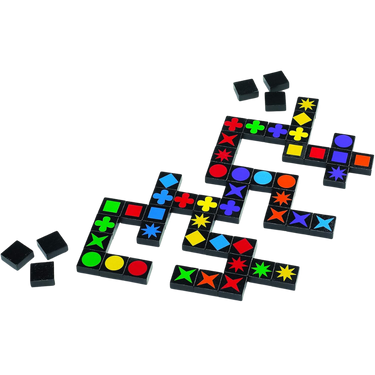 Colorful Qwirkle abstract game tiles from MindWare arranged in a grid on a table.