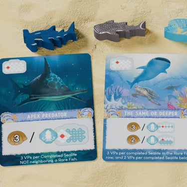 Image of Shallow Sea: Rare Fish mini-expansion for strategy game by Bad Comet featuring detailed aquatic artwork.