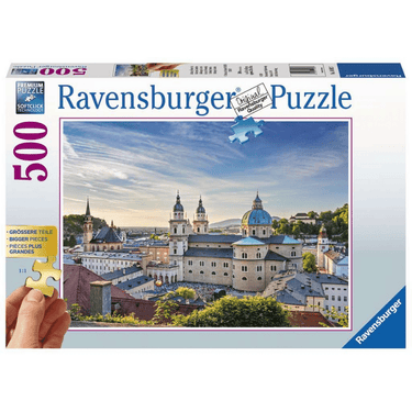 Ravensburger adult puzzle featuring a scenic view of Salzburg, Austria with historic buildings and lush landscape.