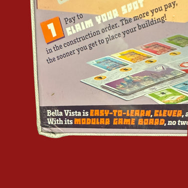 Bella Vista (DAMAGED) - the bottom left corner of the box crushed and folded with the print creased and lifting
