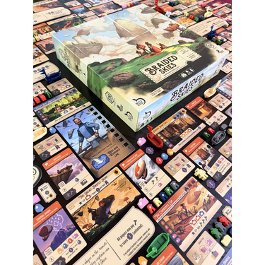 Braided Skies box shown with its cards and components