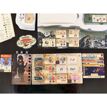 Braided Skies player mat beside the game board