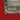 Fourth Wing: Dragons (DAMAGED) - heavy crush damage across the lower left corner of the box back, with deep creasing along the bottom edge