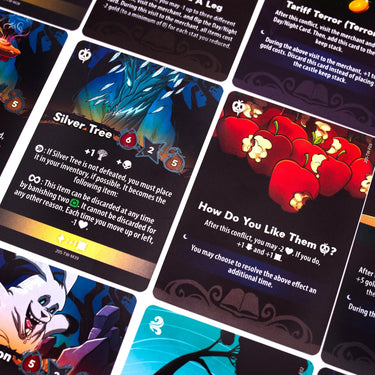 White deck of 20 Strong Tanglewoods strategy game cards by Chip Theory Games, featuring intricate artwork and game symbols.