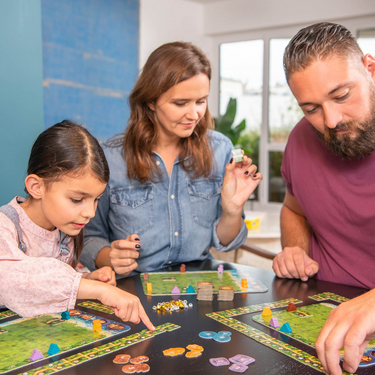 Family playing Karuba