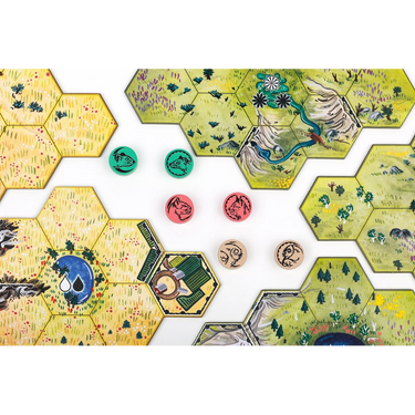 Close-up of Upland & Prairie hex map tiles and screen-printed wooden animal discs