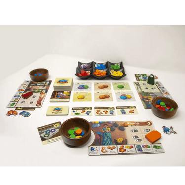 Family game ArchRavels by XYZ Game Labs shown with colorful wooden arches and ravel pieces on a wooden table.