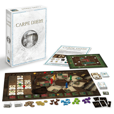 Alea Carpe Diem strategy game box featuring ancient Roman-themed artwork and game components on a wooden table.