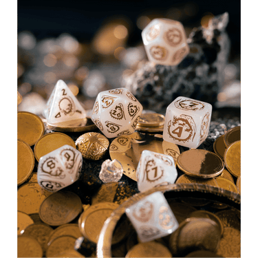 Set of quartz dice with dragon design from Q Workshop's Dragons Dice Set, featuring intricately carved translucent dice.