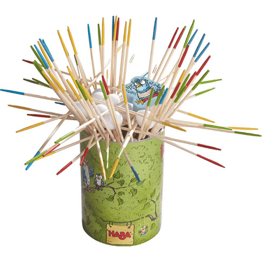 Children's game Go Cuckoo by HABA featuring colorful cuckoo clock and game pieces on a wooden surface.