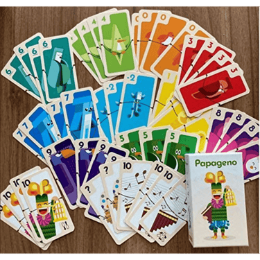 Helvetiq Papageno family game box with colorful cards and game pieces, designed for fun family entertainment.