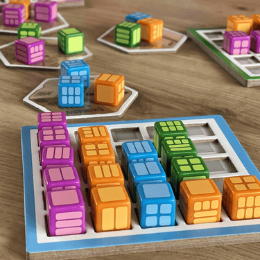 Colorful Shelfie Stacker family game by Arkus Games with wooden blocks stacked in playful arrangement.