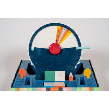 CMYK Wavelength party game box with colorful game components and cards for fun social activities.
